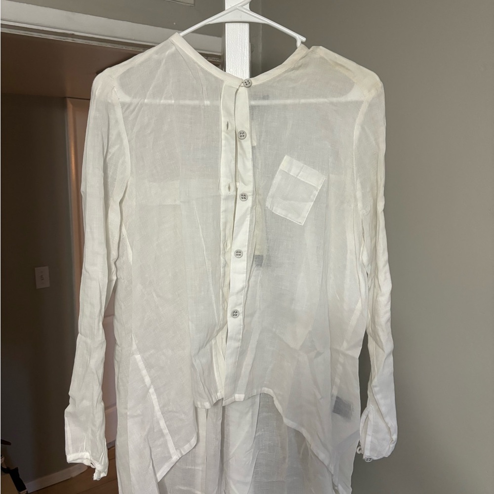 NEW, never worn. Small white women’s blouse.
